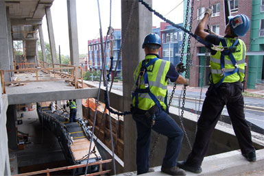 Workers installing an elevator.