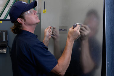 Worker installing panel.